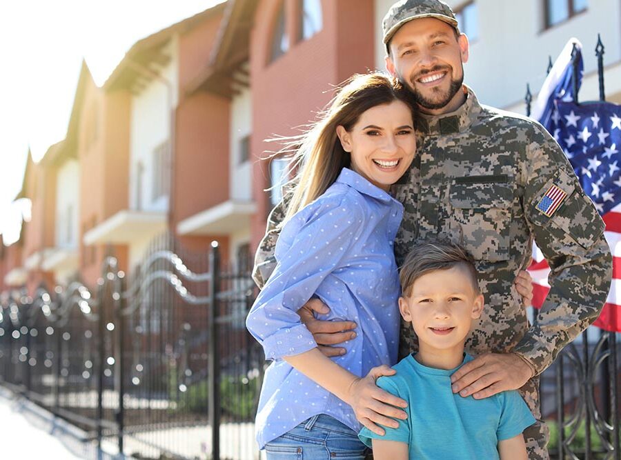 American soldier with family outdoors. Military service